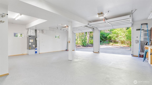 250 E Crest Ln, Grapeview, WA 98546 - garage featuring a garage door opener and heating unit