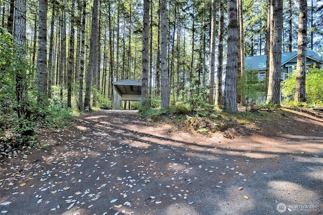 250 E Crest Ln, Grapeview, WA 98546 - view of front of house featuring a view of trees