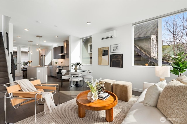 410A 10th Ave E, Seattle, WA 98102 - living area featuring a wall unit AC, dark wood finished floors, recessed lighting, and stairway