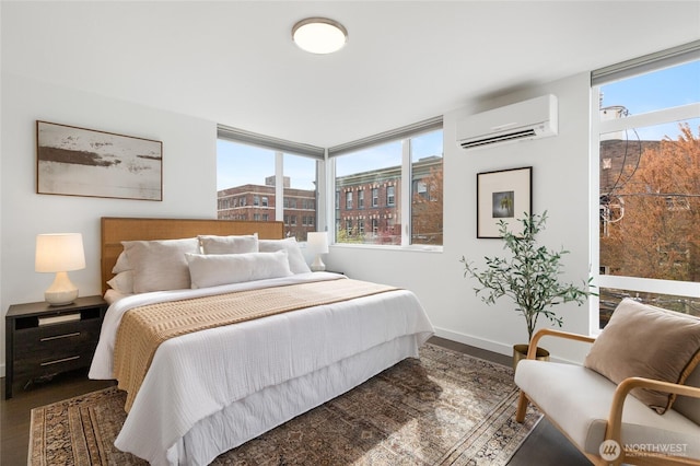 410A 10th Ave E, Seattle, WA 98102 - bedroom featuring an AC wall unit and wood finished floors