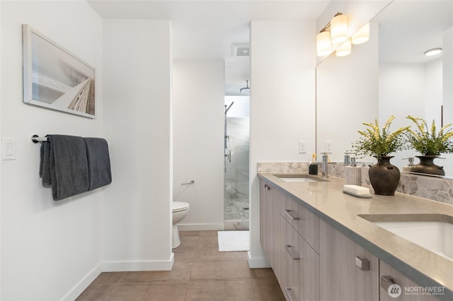 410A 10th Ave E, Seattle, WA 98102 - bathroom featuring double vanity, a shower stall, and tile patterned floors
