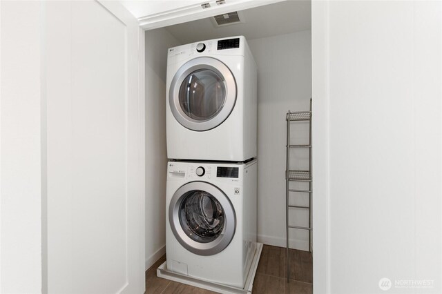 410A 10th Ave E, Seattle, WA 98102 - laundry room with stacked washer / drying machine and wood finished floors