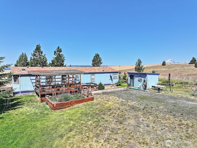 55 Mott Rd, Lyle, WA 98635 - back of property featuring a shed and a vegetable garden