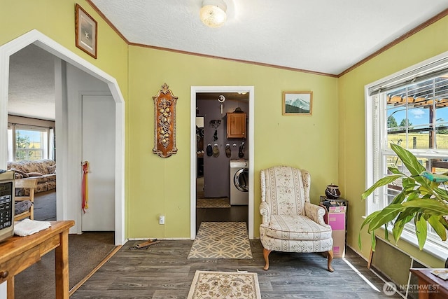 55 Mott Rd, Lyle, WA 98635 - living area with washer / clothes dryer, ornamental molding, wood finished floors, arched walkways, and a textured ceiling