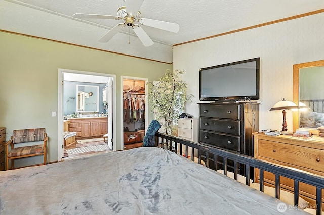 55 Mott Rd, Lyle, WA 98635 - bedroom with ornamental molding, ensuite bath, a spacious closet, and a ceiling fan
