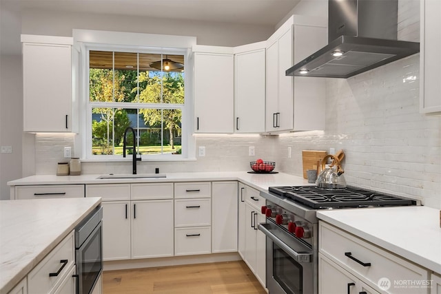 10505 NE 112th St, Kirkland, WA 98033 - kitchen featuring high end stainless steel range, exhaust hood, tasteful backsplash, light countertops, and built in microwave
