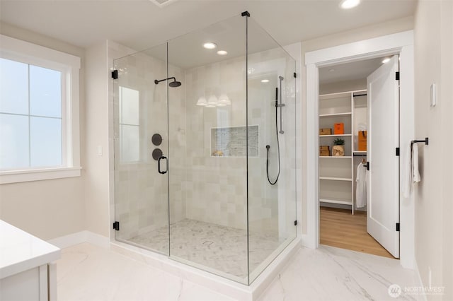 10505 NE 112th St, Kirkland, WA 98033 - bathroom featuring a shower stall, a walk in closet, vanity, and recessed lighting