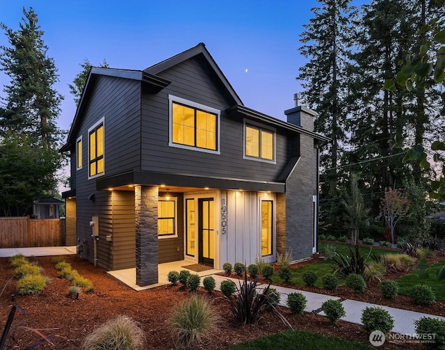 10505 NE 112th St, Kirkland, WA 98033 - modern home featuring a chimney and a porch