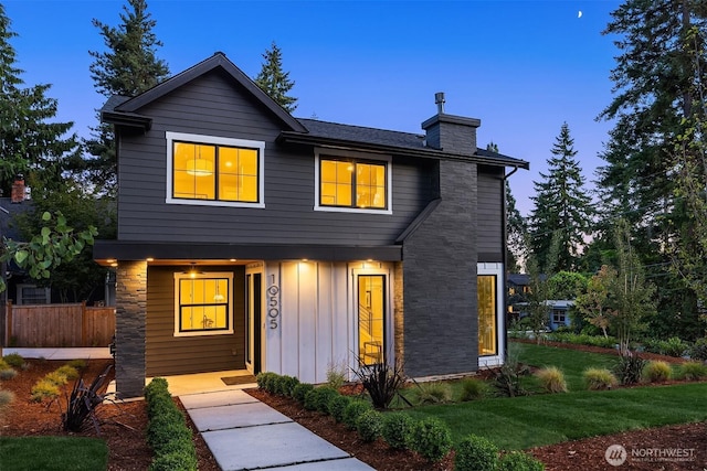 10505 NE 112th St, Kirkland, WA 98033 - view of front of property with board and batten siding, a chimney, covered porch, and a front yard
