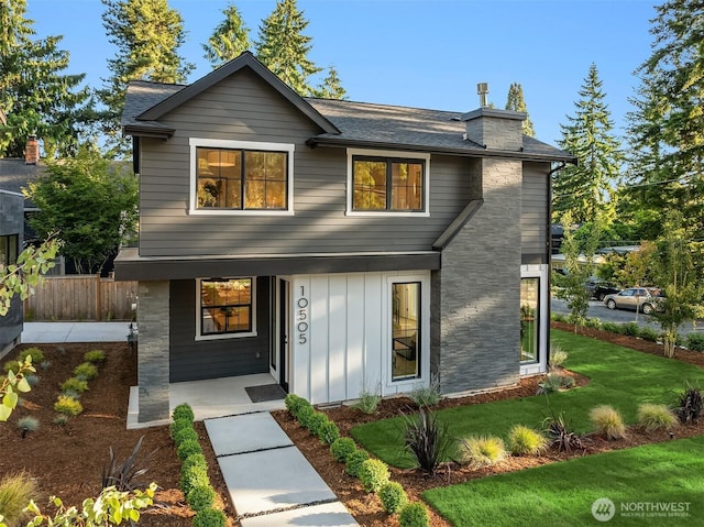 10505 NE 112th St, Kirkland, WA 98033 - view of front of property featuring board and batten siding, a chimney, a shingled roof, and covered porch