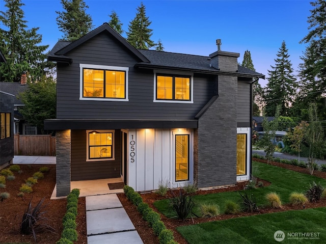 10505 NE 112th St, Kirkland, WA 98033 - view of front of property featuring board and batten siding, a porch, a lawn, a chimney, and roof with shingles