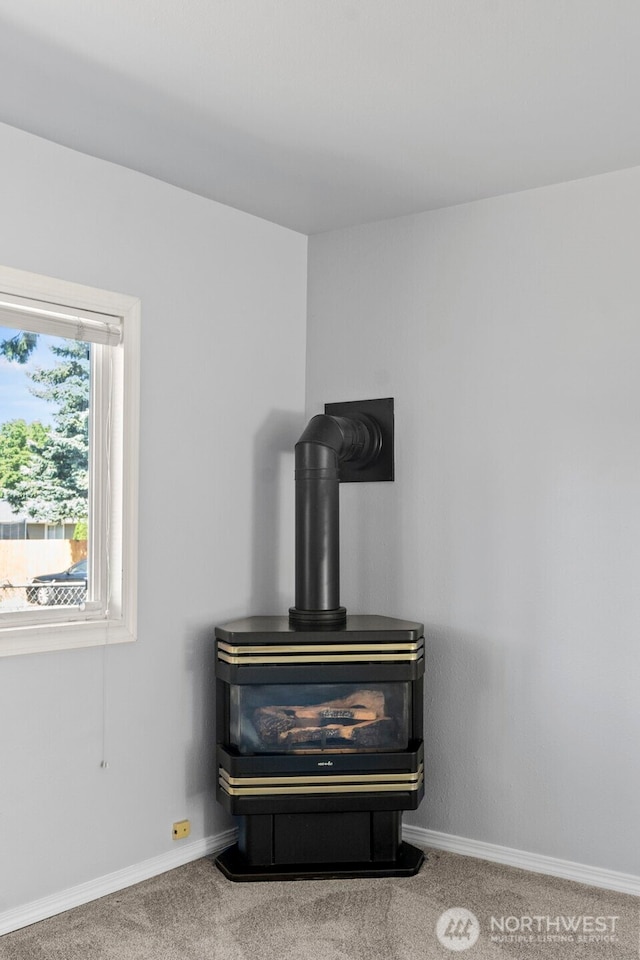610 128th St S, Tacoma, WA 98444 - detailed view of carpet floors and a wood stove