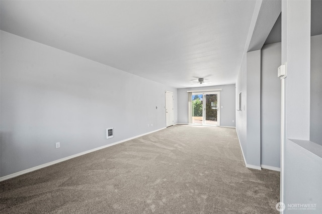 610 128th St S, Tacoma, WA 98444 - carpeted spare room featuring baseboards and a ceiling fan