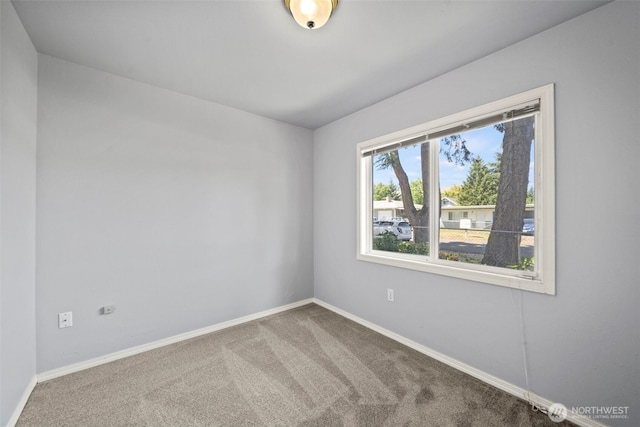 610 128th St S, Tacoma, WA 98444 - carpeted spare room featuring baseboards