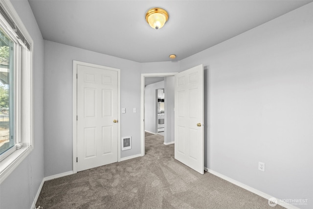 610 128th St S, Tacoma, WA 98444 - unfurnished bedroom with carpet and baseboards