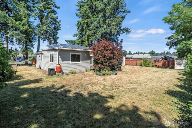 610 128th St S, Tacoma, WA 98444 - rear view of house with solar panels and a metal roof