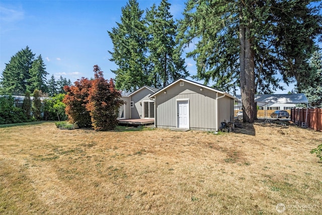 610 128th St S, Tacoma, WA 98444 - view of yard featuring a storage shed and a wooden deck