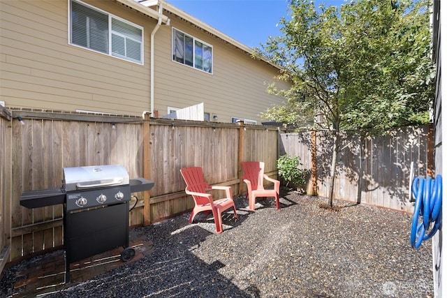 3312 156th St SW Unit E4, Lynnwood, WA 98087 - fenced backyard with area for grilling and a patio