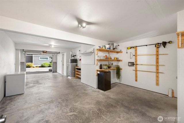 3312 156th St SW Unit E4, Lynnwood, WA 98087 - garage with fridge and water heater