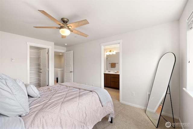 3312 156th St SW Unit E4, Lynnwood, WA 98087 - bedroom featuring light colored carpet, ensuite bath, a ceiling fan, and a spacious closet