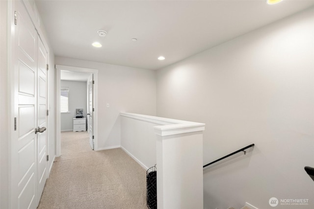 3312 156th St SW Unit E4, Lynnwood, WA 98087 - hallway featuring an upstairs landing, light colored carpet, and recessed lighting