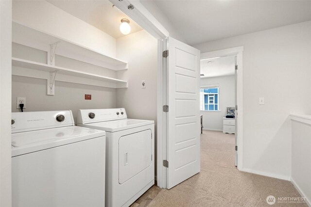 3312 156th St SW Unit E4, Lynnwood, WA 98087 - laundry room with washer and clothes dryer and light colored carpet