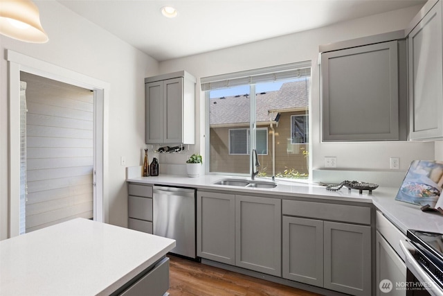 3312 156th St SW Unit E4, Lynnwood, WA 98087 - kitchen featuring stainless steel dishwasher, gray cabinets, recessed lighting, and dark wood-style flooring