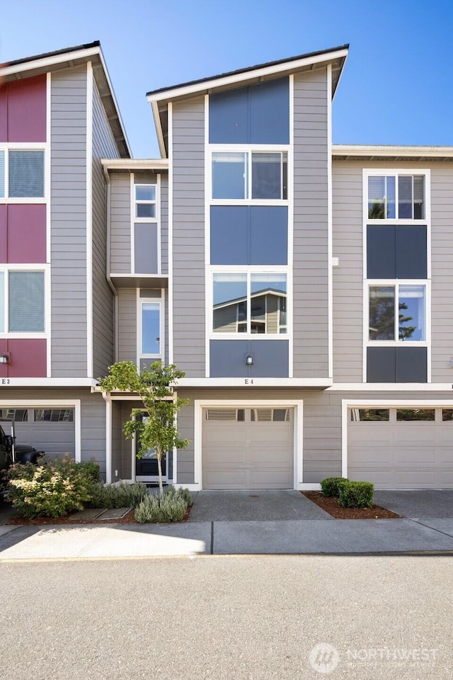 3312 156th St SW Unit E4, Lynnwood, WA 98087 - townhome / multi-family property with driveway and an attached garage