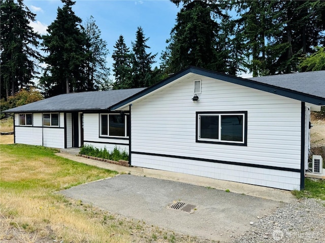 12706 94th Ave E, Puyallup, WA 98373 - view of front of house featuring a front yard, a patio area, and roof with shingles