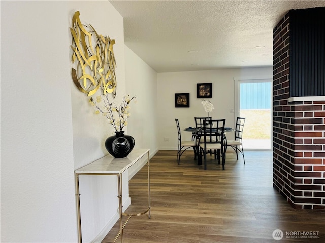 12706 94th Ave E, Puyallup, WA 98373 - dining room featuring wood finished floors and a textured ceiling