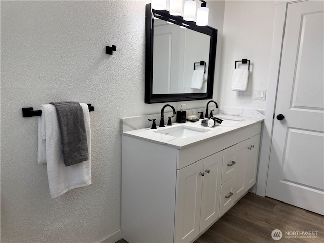 12706 94th Ave E, Puyallup, WA 98373 - full bath with double vanity, wood finished floors, and a textured wall