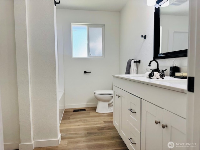 12706 94th Ave E, Puyallup, WA 98373 - full bath featuring vanity and wood finished floors