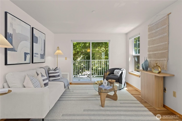 2820 E Madison St Unit 204, Seattle, WA 98112 - living room featuring wood finished floors and baseboards