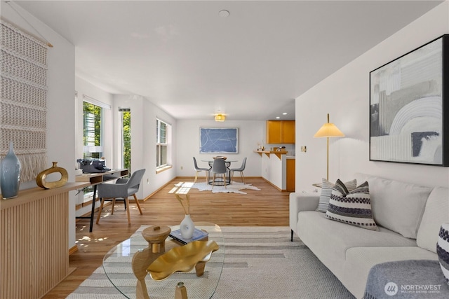 2820 E Madison St Unit 204, Seattle, WA 98112 - living room with light wood finished floors and a desk