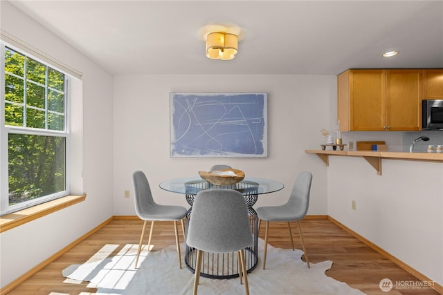 2820 E Madison St Unit 204, Seattle, WA 98112 - dining space featuring healthy amount of natural light, light wood-style floors, and recessed lighting