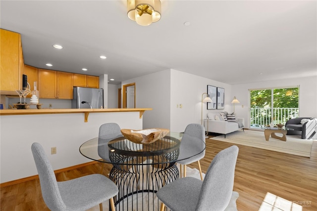 2820 E Madison St Unit 204, Seattle, WA 98112 - dining room featuring light wood-style floors and recessed lighting