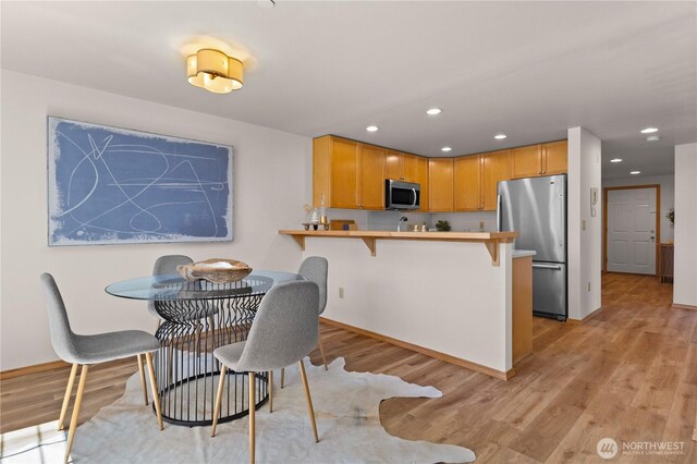 2820 E Madison St Unit 204, Seattle, WA 98112 - dining space with recessed lighting and light wood finished floors