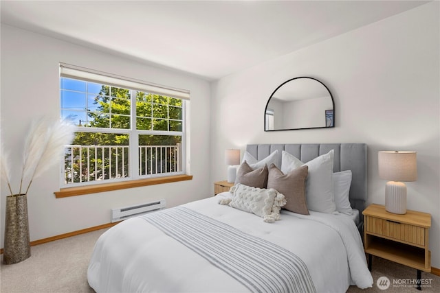 2820 E Madison St Unit 204, Seattle, WA 98112 - carpeted bedroom featuring a baseboard radiator and baseboards