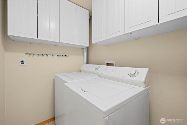 2820 E Madison St Unit 204, Seattle, WA 98112 - laundry area with cabinet space and washer and clothes dryer