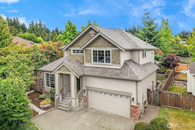 3606 Monterey Ct NE, Renton, WA 98056 - view of front facade featuring a shingled roof, a garage, and concrete driveway