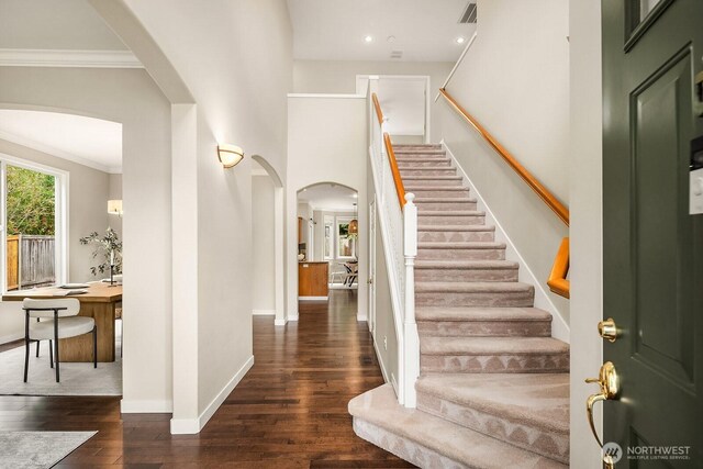 3606 Monterey Ct NE, Renton, WA 98056 - entrance foyer with arched walkways, hardwood / wood-style floors, stairway, crown molding, and recessed lighting