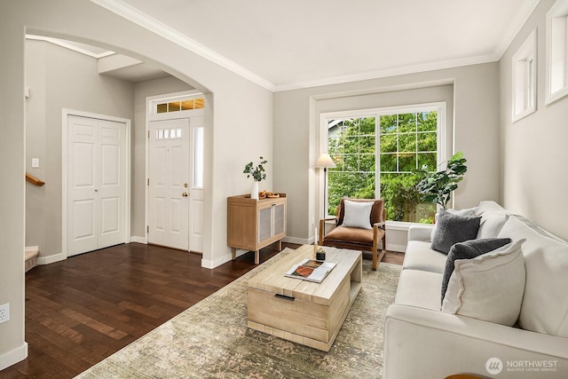 3606 Monterey Ct NE, Renton, WA 98056 - living area featuring arched walkways, dark wood-style flooring, and ornamental molding
