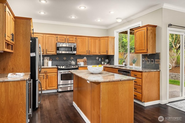 3606 Monterey Ct NE, Renton, WA 98056 - kitchen with appliances with stainless steel finishes, dark wood-style floors, backsplash, a center island, and recessed lighting