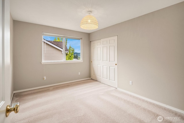 3606 Monterey Ct NE, Renton, WA 98056 - unfurnished bedroom with light carpet and a closet