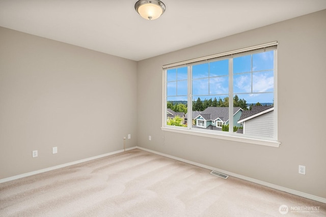 3606 Monterey Ct NE, Renton, WA 98056 - carpeted spare room featuring baseboards