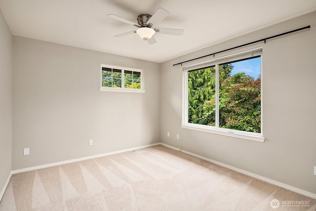 3606 Monterey Ct NE, Renton, WA 98056 - empty room featuring light colored carpet and a ceiling fan