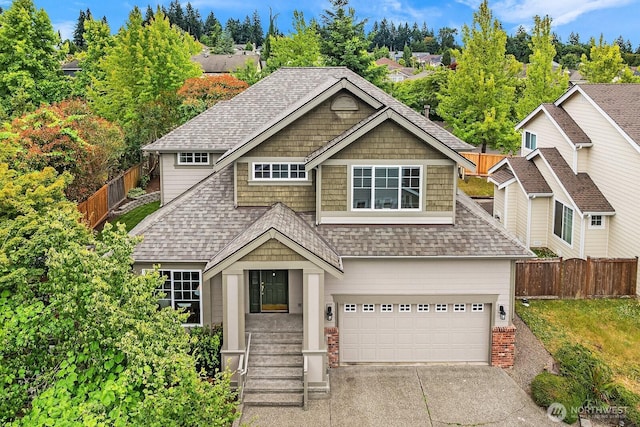 3606 Monterey Ct NE, Renton, WA 98056 - view of front of home with a shingled roof, concrete driveway, and an attached garage