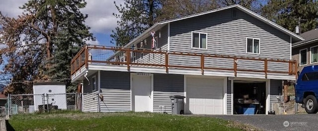 915 N Hofstetter St, Colville, WA 99114 - back of house featuring a balcony and a garage