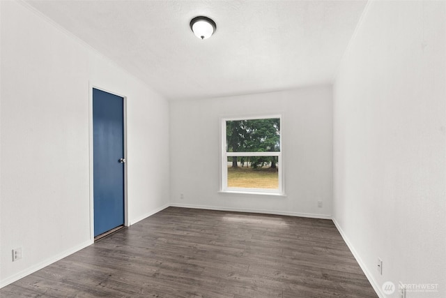 8222 Bordeaux Rd SW, Olympia, WA 98512 - empty room featuring dark wood-type flooring and baseboards