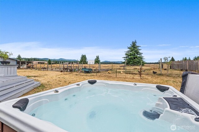 8222 Bordeaux Rd SW, Olympia, WA 98512 - view of pool featuring a hot tub, a mountain view, and a view of countryside